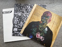 two cds with a picture of a man and a flower